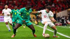 Morocco's midfielder #17 Abde Ezzalzouli fights for the ball with Senegal's defender #24 Antoine Mendy during the Africa Cup of Nations (CAN) final football match between Senegal and Morocco at the Prince Moulay Abdellah Stadium in Rabat on January 18, 2026. (Photo by FRANCK FIFE / AFP)